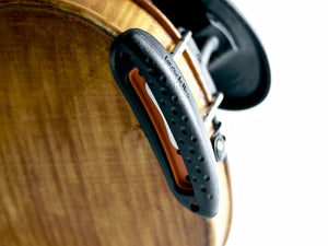 Close-up of the kréddle Cushion shoulder rest in ebony/orange from the bottom.