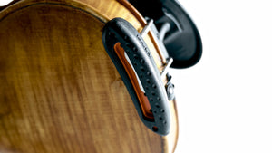 Close-up of the kréddle Cushion shoulder rest in ebony/orange from the bottom.